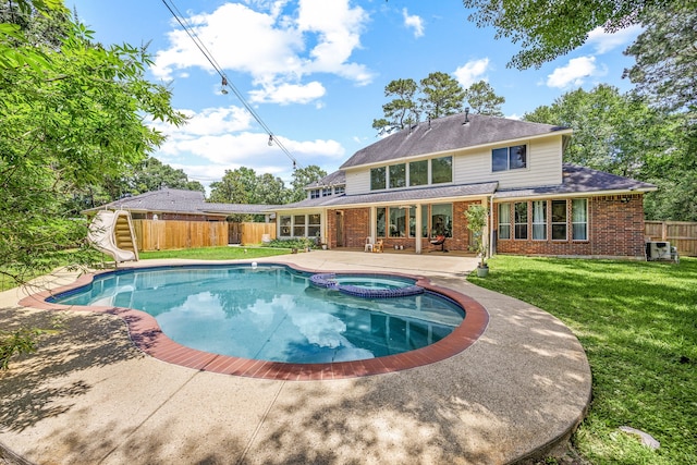 14742 Timbergreen Dr, Magnolia, TX 77355 - view of swimming pool featuring a water slide, a patio area, and a pool with connected hot tub