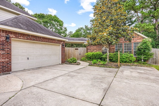 14742 Timbergreen Dr, Magnolia, TX 77355 - view of home's exterior with brick siding, fence, and driveway