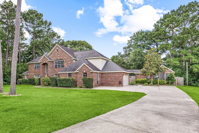 14742 Timbergreen Dr, Magnolia, TX 77355 - view of front of home featuring brick siding, concrete driveway, a shingled roof, and a garage