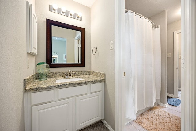 14742 Timbergreen Dr, Magnolia, TX 77355 - full bath featuring tile patterned floors, vanity, curtained shower, and baseboards