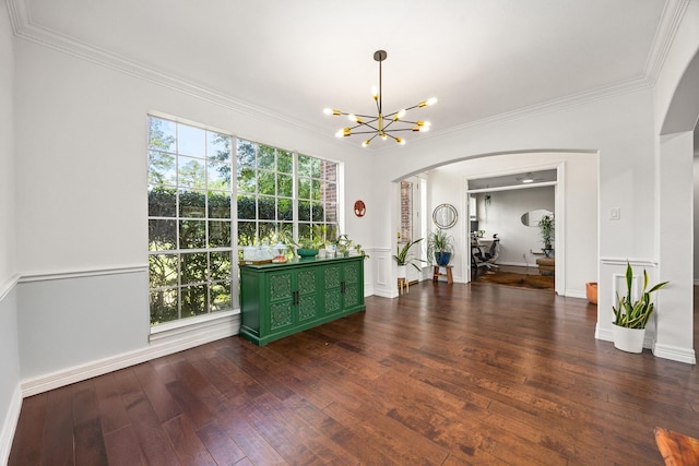 14742 Timbergreen Dr, Magnolia, TX 77355 - unfurnished dining area featuring arched walkways, a chandelier, dark wood finished floors, crown molding, and baseboards