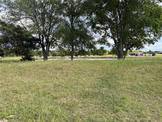 3876 Hummingbird, Bedias, TX 77831 - view of yard featuring a water view