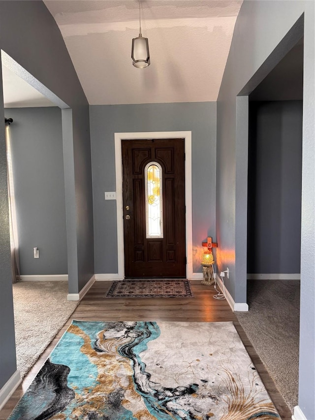 3876 Hummingbird, Bedias, TX 77831 - foyer featuring vaulted ceiling and baseboards