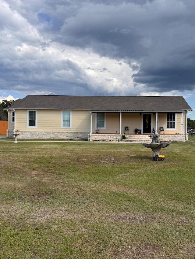 3876 Hummingbird, Bedias, TX 77831 - view of front facade featuring a front lawn and stone siding