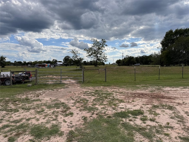 3876 Hummingbird, Bedias, TX 77831 - view of yard with a gate and a view of countryside
