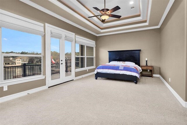 253 Capetown, Montgomery, TX 77356 - carpeted bedroom with ornamental molding, access to exterior, a raised ceiling, baseboards, and french doors