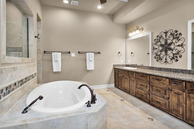253 Capetown, Montgomery, TX 77356 - bathroom with a garden tub, vanity, recessed lighting, a tile shower, and baseboards