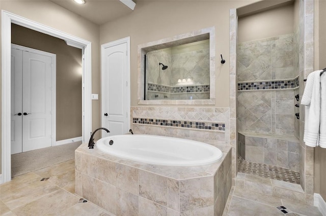 253 Capetown, Montgomery, TX 77356 - full bathroom with a garden tub, a tile shower, tile patterned floors, and baseboards