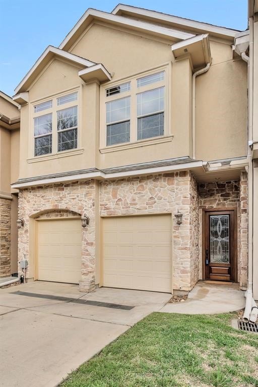 253 Capetown, Montgomery, TX 77356 - multi unit property with stucco siding, stone siding, a garage, and driveway