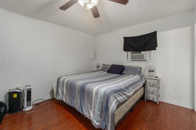 3824 Tower Rd, Santa Fe, TX 77517 - bedroom with wood finished floors, cooling unit, a ceiling fan, and baseboards