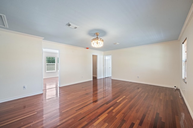20151 Pioneer Ridge Dr, Cypress, TX 77433 - empty room with ornamental molding, baseboards, dark wood finished floors, and a chandelier