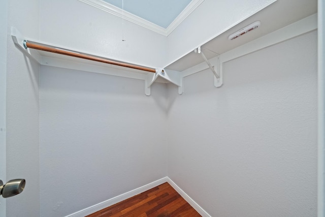 20151 Pioneer Ridge Dr, Cypress, TX 77433 - walk in closet featuring dark wood finished floors and attic access
