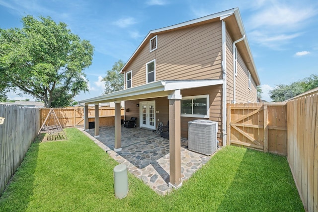 20151 Pioneer Ridge Dr, Cypress, TX 77433 - rear view of property featuring french doors, central AC, a gate, and a patio