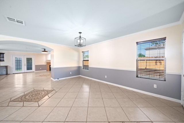 20151 Pioneer Ridge Dr, Cypress, TX 77433 - unfurnished room with arched walkways, light tile patterned floors, crown molding, baseboards, and a chandelier