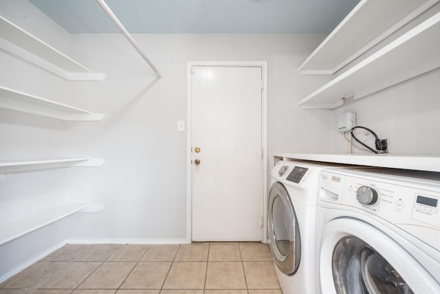 20151 Pioneer Ridge Dr, Cypress, TX 77433 - laundry room with washing machine and dryer and light tile patterned floors