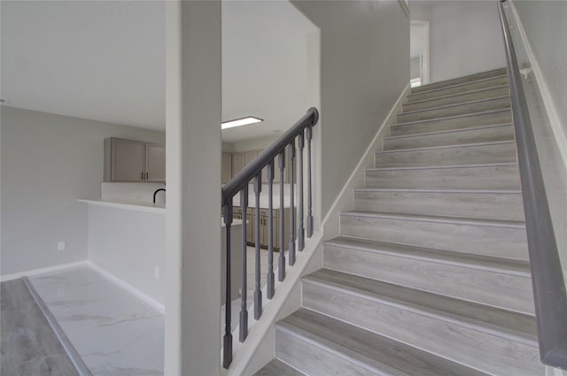 11623 Silent Elm St, Houston, TX 77044 - staircase featuring baseboards