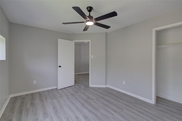 11623 Silent Elm St, Houston, TX 77044 - unfurnished bedroom featuring wood finished floors, a closet, and baseboards