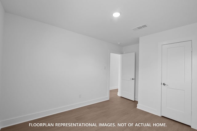 20526 Draper Rd, Tomball, TX 77377 - unfurnished bedroom with wood finished floors and baseboards