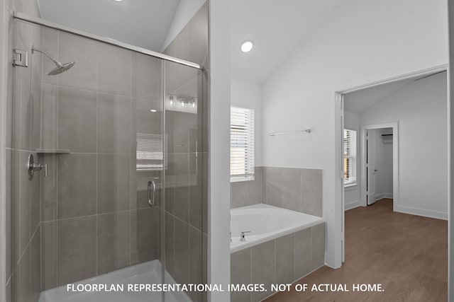 20526 Draper Rd, Tomball, TX 77377 - bathroom featuring vaulted ceiling, a stall shower, a garden tub, and wood finished floors