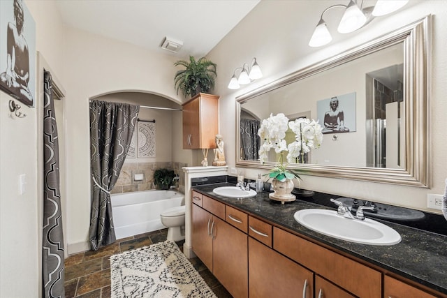 bathroom with a tub to relax in, stone tile flooring, double vanity, toilet, and a shower with shower curtain