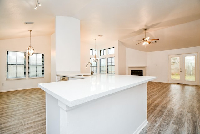 4618 Leicester Way, Missouri City, TX 77459 - kitchen with a chandelier, a sink, ceiling fan, lofted ceiling, and light wood-style flooring