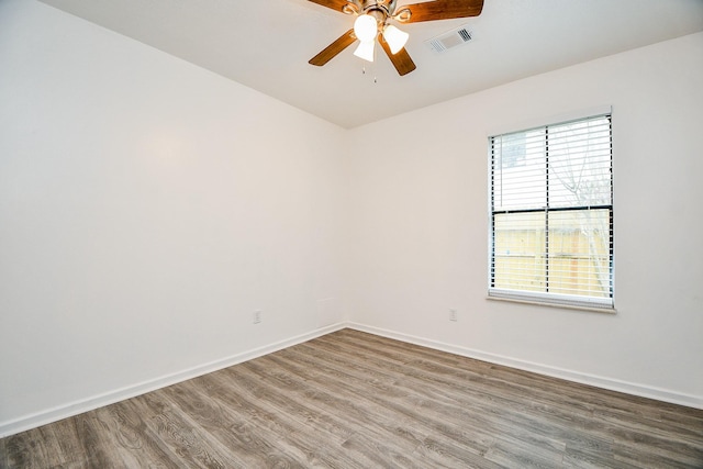 4618 Leicester Way, Missouri City, TX 77459 - spare room with wood finished floors, ceiling fan, and baseboards