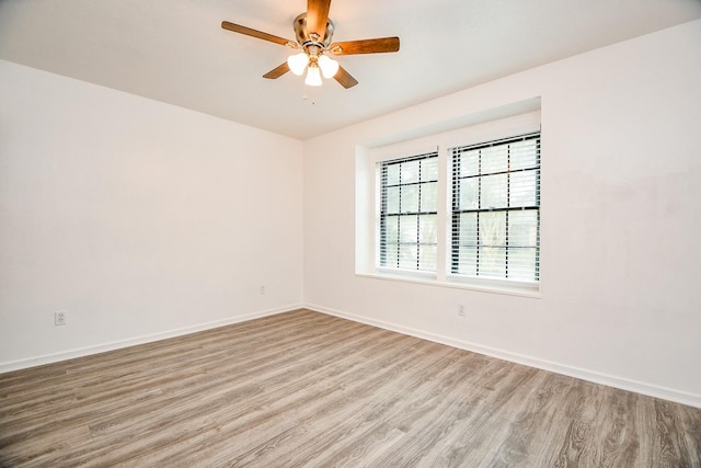 4618 Leicester Way, Missouri City, TX 77459 - unfurnished room with light wood-style flooring, a ceiling fan, and baseboards