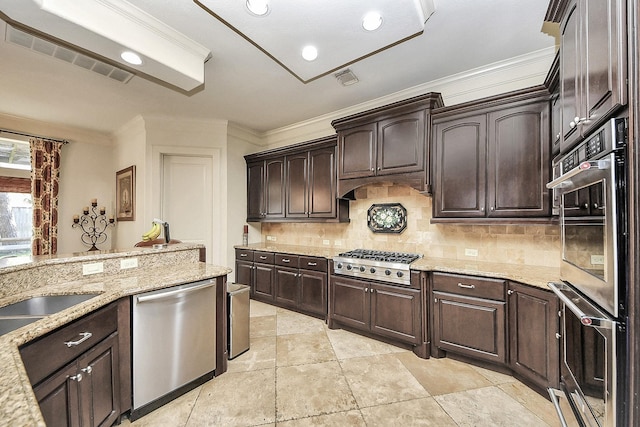 5701 Sugar Hill Dr, Houston, TX 77057 - kitchen featuring stainless steel appliances, ornamental molding, tasteful backsplash, light stone countertops, and dark brown cabinets