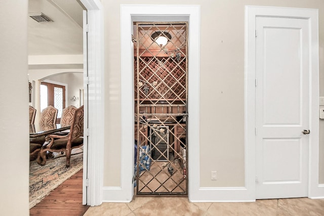 5701 Sugar Hill Dr, Houston, TX 77057 - wine cellar with arched walkways and baseboards