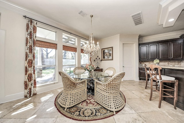 5701 Sugar Hill Dr, Houston, TX 77057 - dining area featuring crown molding, a chandelier, baseboards, and light tile patterned flooring