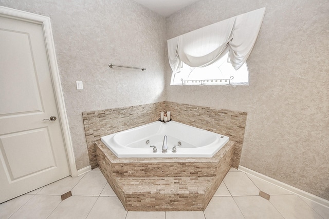 5701 Sugar Hill Dr, Houston, TX 77057 - full bath with tile patterned flooring, a tub with jets, and baseboards