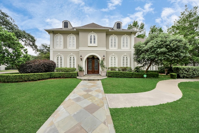 5701 Sugar Hill Dr, Houston, TX 77057 - mediterranean / spanish-style home with french doors, a front lawn, and stucco siding