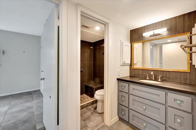 411 Westmoreland St Unit 1, Houston, TX 77006 - bathroom featuring toilet, vanity, baseboards, and a shower stall