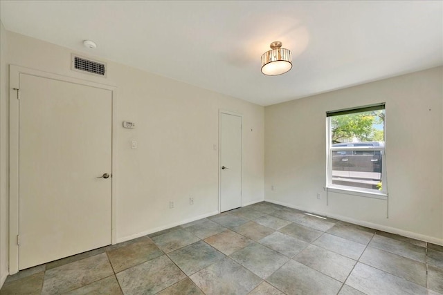 411 Westmoreland St Unit 1, Houston, TX 77006 - empty room featuring baseboards and a smoke detector