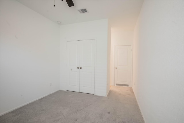 22065 Juniper Crossing Dr, New Caney, TX 77357 - unfurnished bedroom with carpet flooring, a closet, baseboards, and a ceiling fan