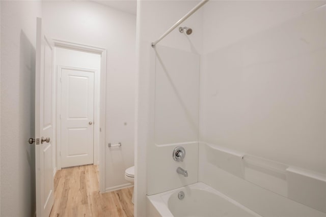 22065 Juniper Crossing Dr, New Caney, TX 77357 - full bathroom with toilet, wood finished floors, and bathing tub / shower combination