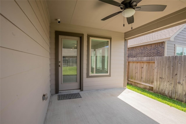 22065 Juniper Crossing Dr, New Caney, TX 77357 - entrance to property with fence, a ceiling fan, and a patio