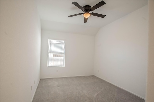 22065 Juniper Crossing Dr, New Caney, TX 77357 - spare room featuring light carpet, baseboards, a ceiling fan, and vaulted ceiling