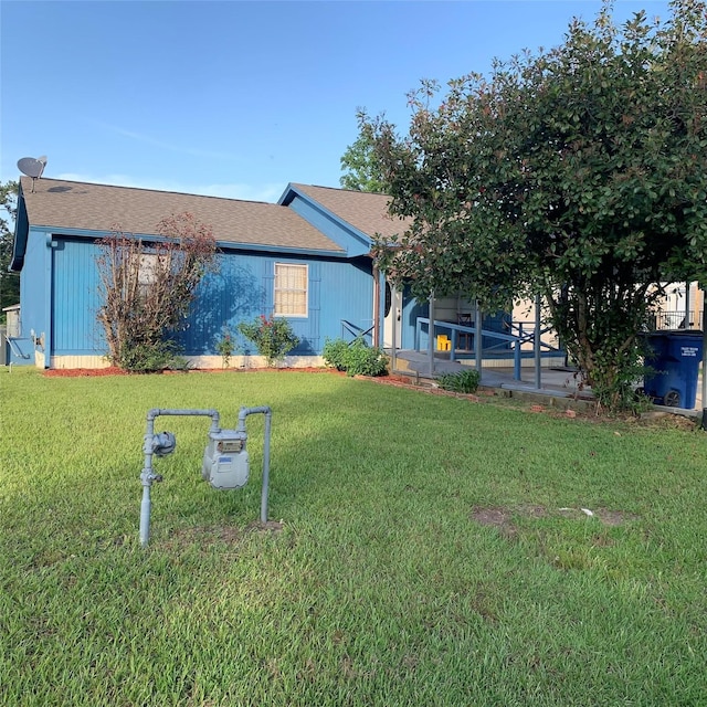 324 Persimmon Rd, Onalaska, TX 77360 - view of front of home featuring a front yard and a shingled roof