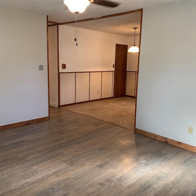 324 Persimmon Rd, Onalaska, TX 77360 - empty room featuring baseboards, wood finished floors, and a ceiling fan