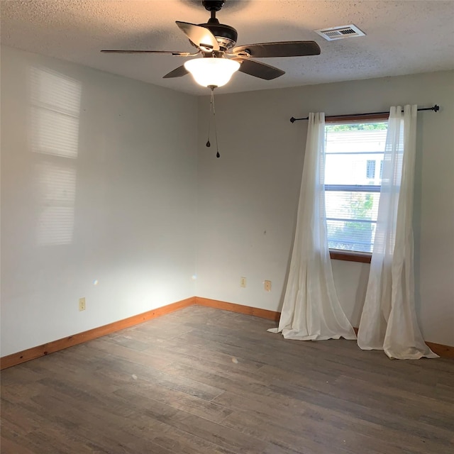 324 Persimmon Rd, Onalaska, TX 77360 - empty room with wood finished floors, a textured ceiling, baseboards, and a ceiling fan