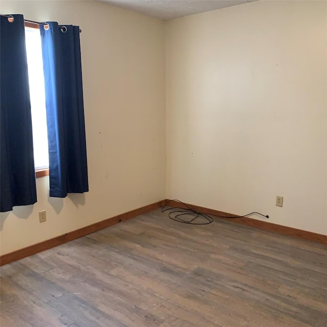 324 Persimmon Rd, Onalaska, TX 77360 - empty room with wood finished floors and baseboards