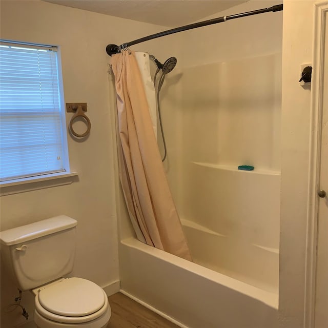 324 Persimmon Rd, Onalaska, TX 77360 - full bathroom featuring toilet, shower / bath combo, baseboards, and wood finished floors