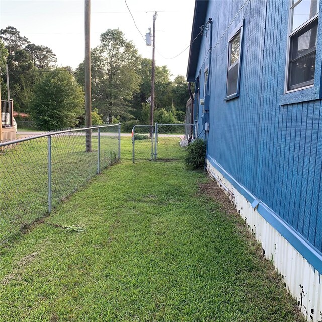 324 Persimmon Rd, Onalaska, TX 77360 - view of yard featuring a gate