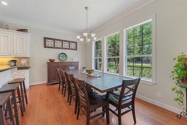 711 Valley Commons Dr, Huffman, TX 77336 - dining area with plenty of natural light, a chandelier, baseboards, ornamental molding, and light wood-type flooring