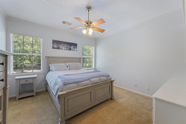 711 Valley Commons Dr, Huffman, TX 77336 - bedroom with light carpet, ornamental molding, baseboards, and a ceiling fan