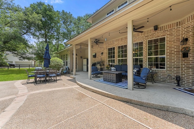 711 Valley Commons Dr, Huffman, TX 77336 - view of patio / terrace with an outdoor living space, a ceiling fan, and outdoor dining area
