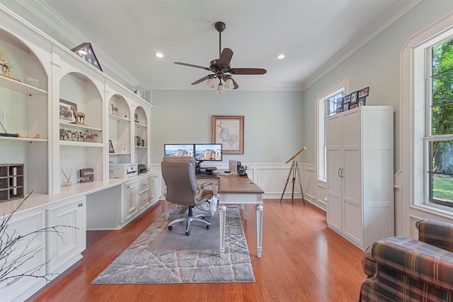 711 Valley Commons Dr, Huffman, TX 77336 - office with healthy amount of natural light, wood finished floors, crown molding, a ceiling fan, and a wainscoted wall