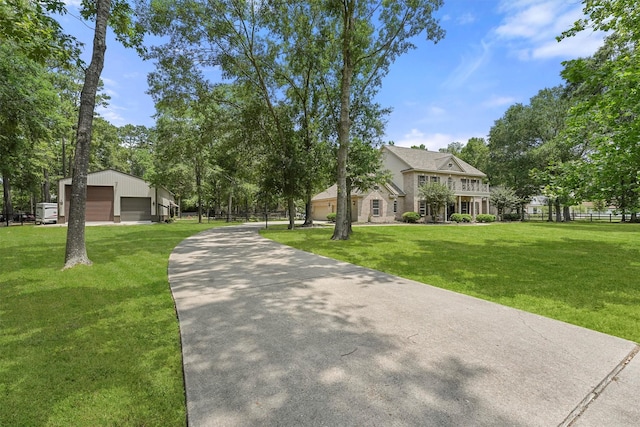 711 Valley Commons Dr, Huffman, TX 77336 - view of property's community with a garage and an outbuilding