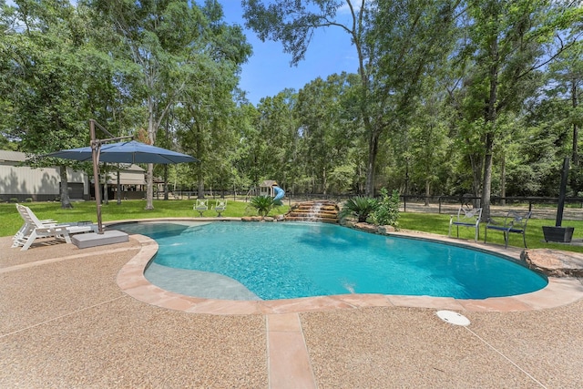 711 Valley Commons Dr, Huffman, TX 77336 - view of swimming pool featuring a patio and view of scattered trees